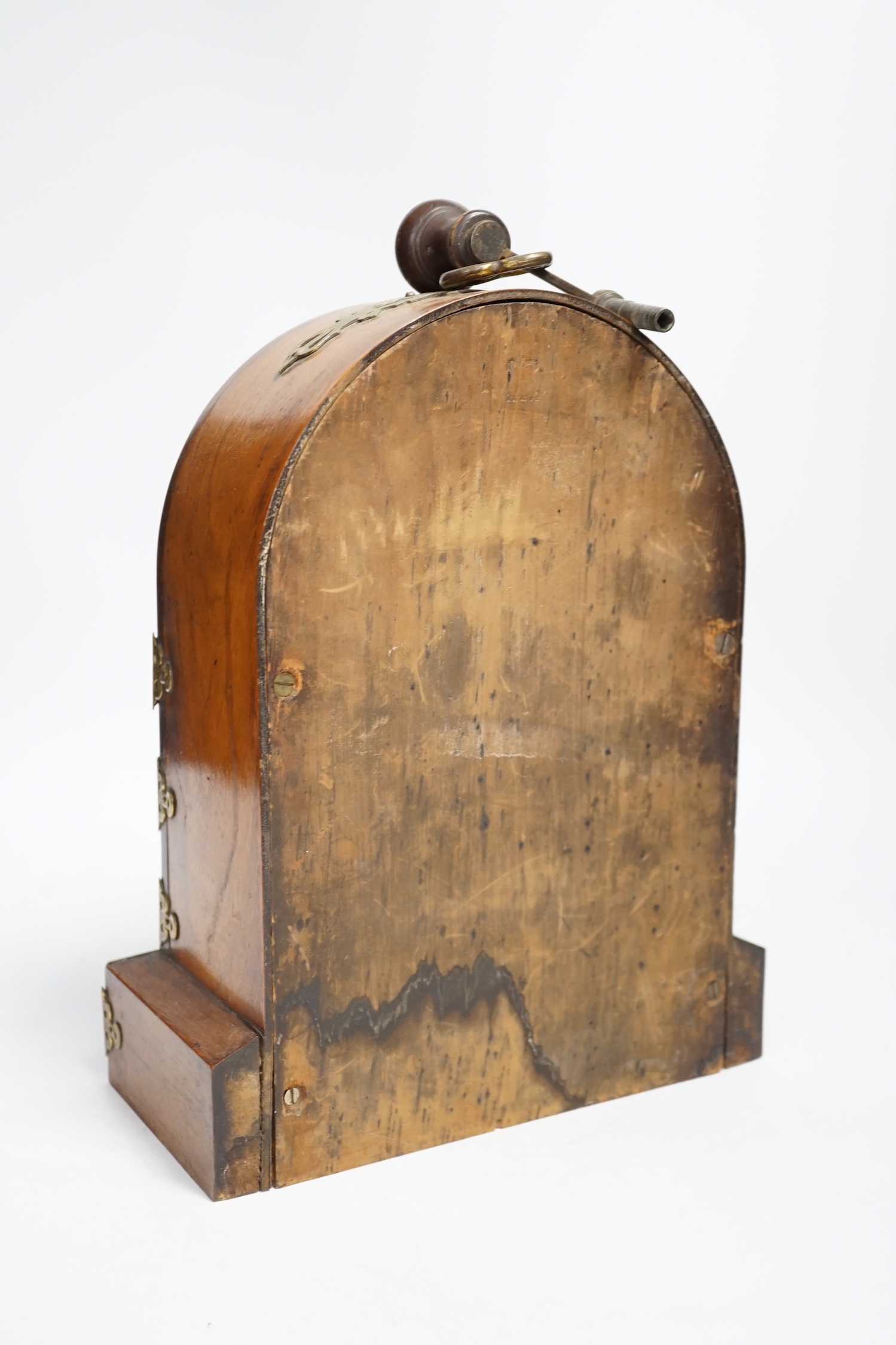 A Victorian walnut and brass mounted mantel clock, 26cm high